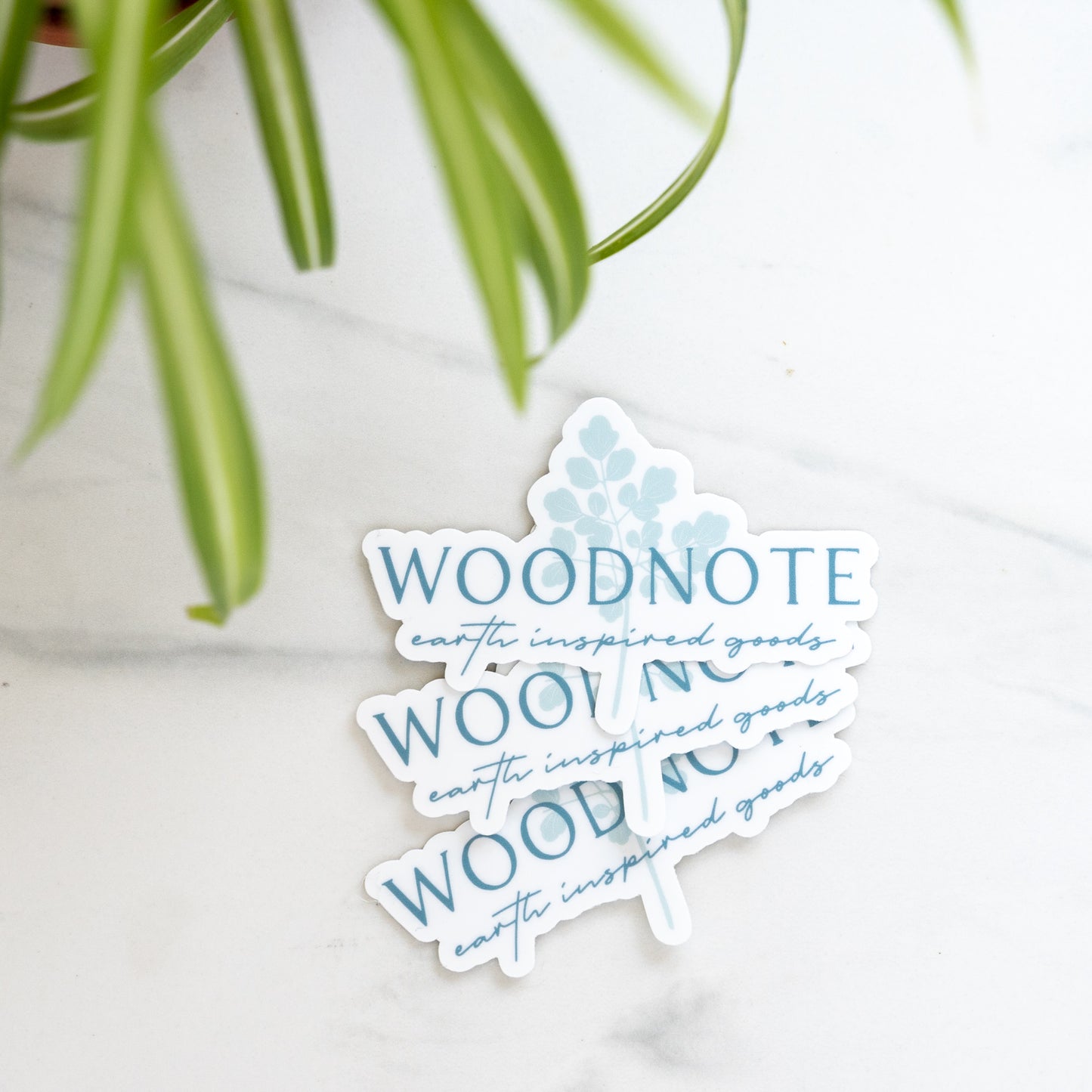 Vinyl Woodnote logo stickers on marble