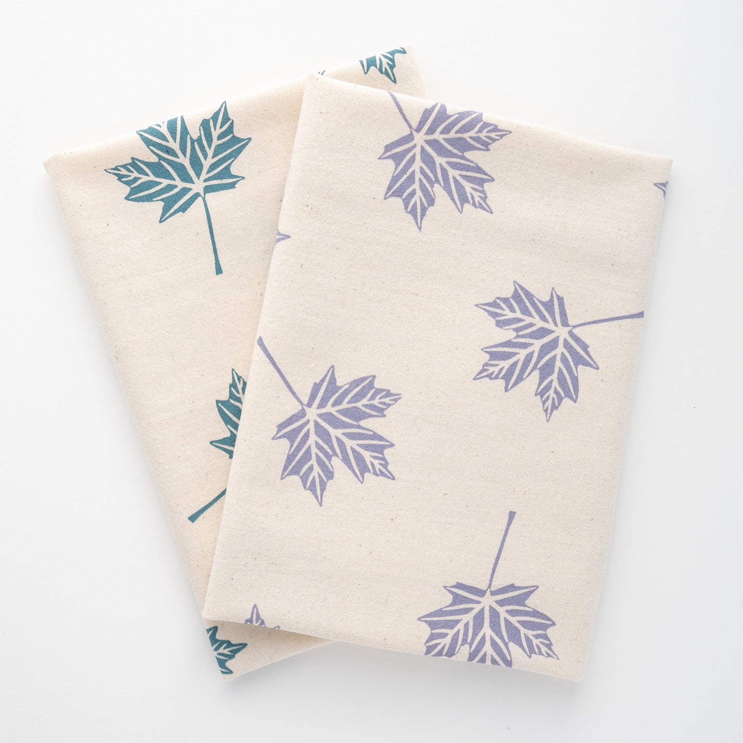 Blue and lavender printed maple leaf tea towels